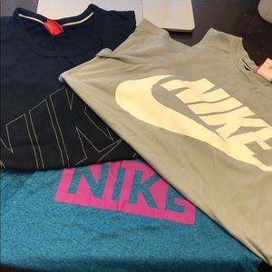 (3) Nike essential muscle tanks.